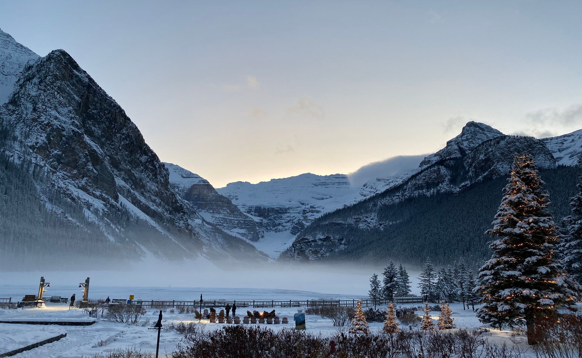 Snow-covered mountains surrounding Lake Louise in Alberta, Canada