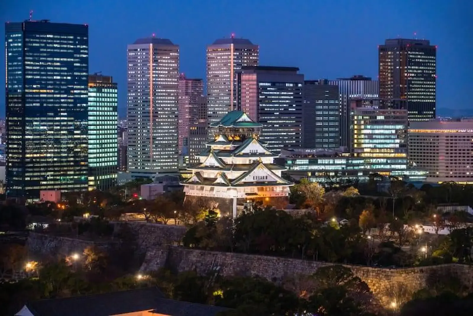 Osaka Castle illuminated in the evening light in Osaka