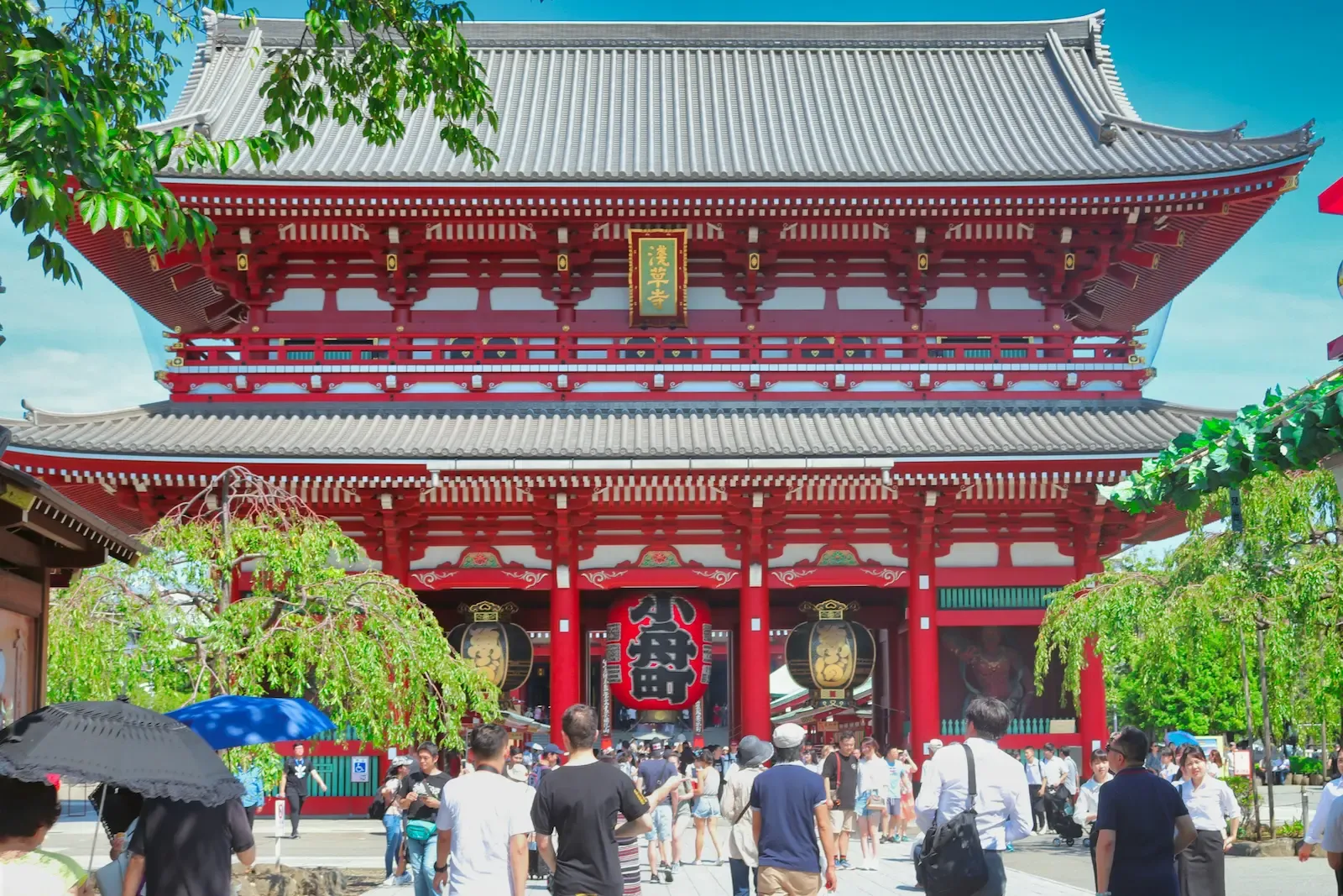 Visitors walking near Senso-ji temple in Asakusa, Tokyo
